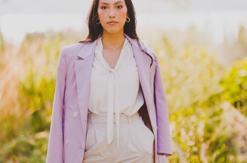 Female Lawyer doing a power pose in front of a tree landscape