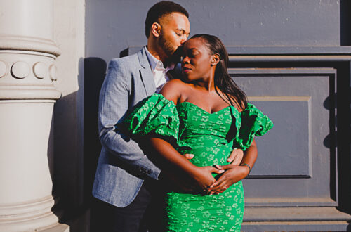 black couple hugging and kissing in Soho NYC