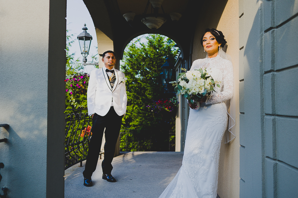 Couple posing separately on the terrace in Long Island Wedding Venue Jericho Terrace