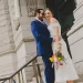 Couple in front of civic building after city hall wedding